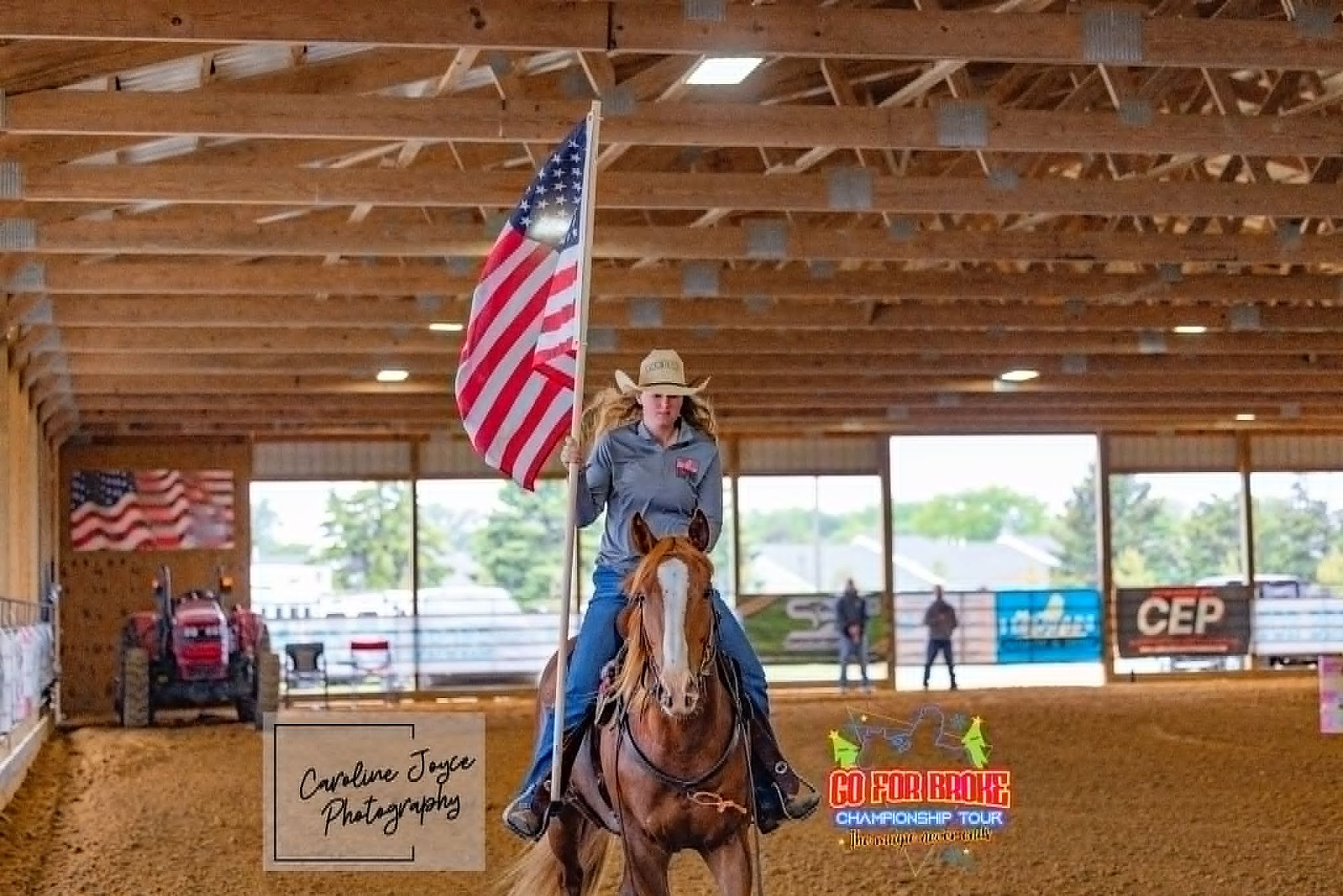Go For Broke competitor carrying the flag